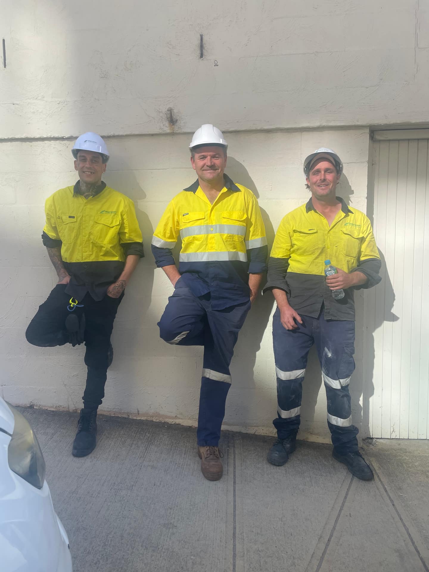 Three Reboot workers in hi-vis on site